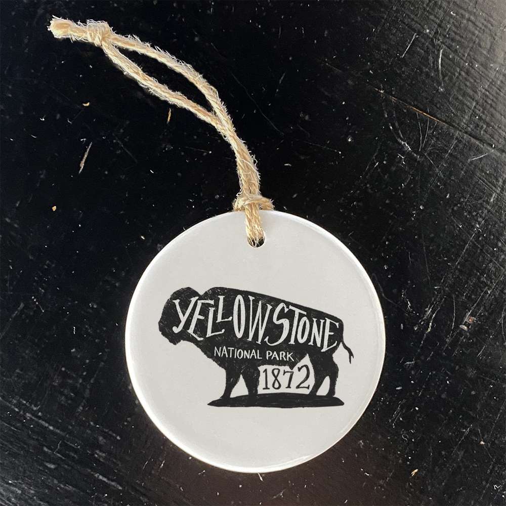 A beautifully crafted porcelain ornament featuring a buffalo design, representing Yellowstone National Park, with a smooth gloss finish.
