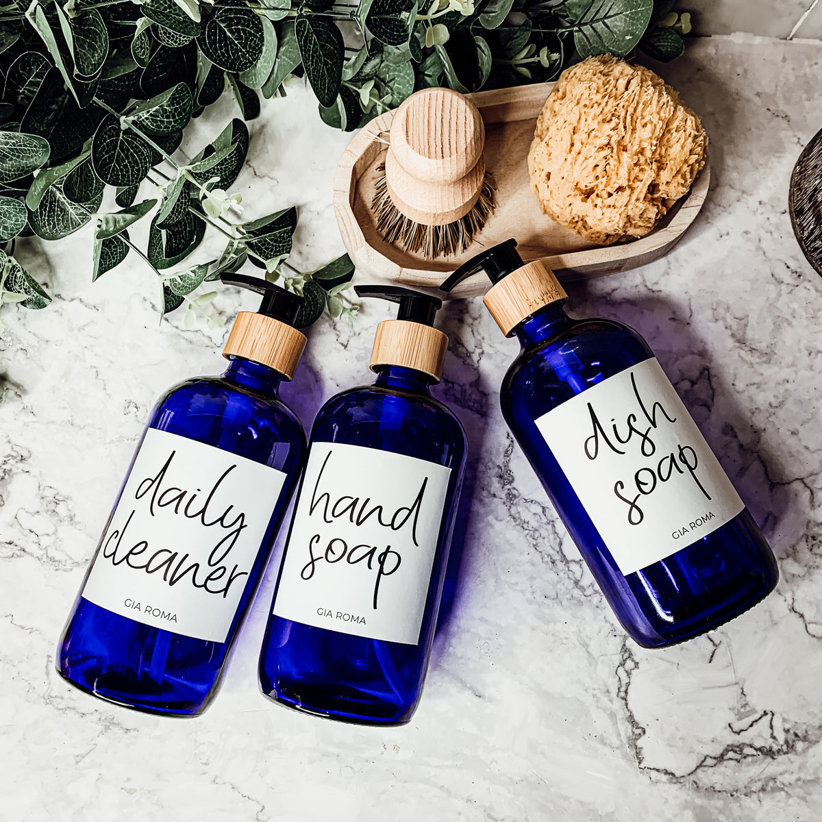 16oz blue glass dispenser with customizable waterproof labels, perfect for home decor.