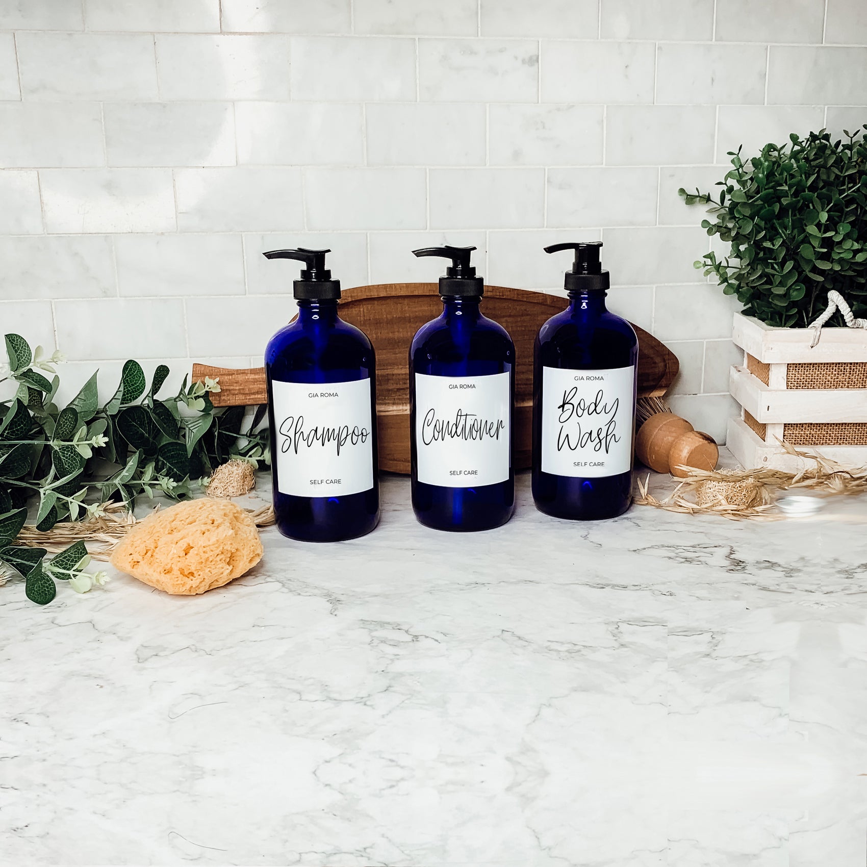 16oz blue glass dispenser with customizable waterproof labels, perfect for home decor.