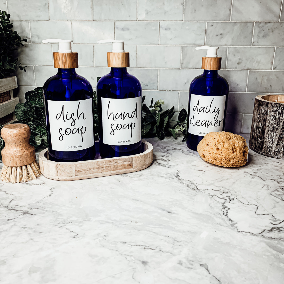 16oz blue glass dispenser with customizable waterproof labels, perfect for home decor.