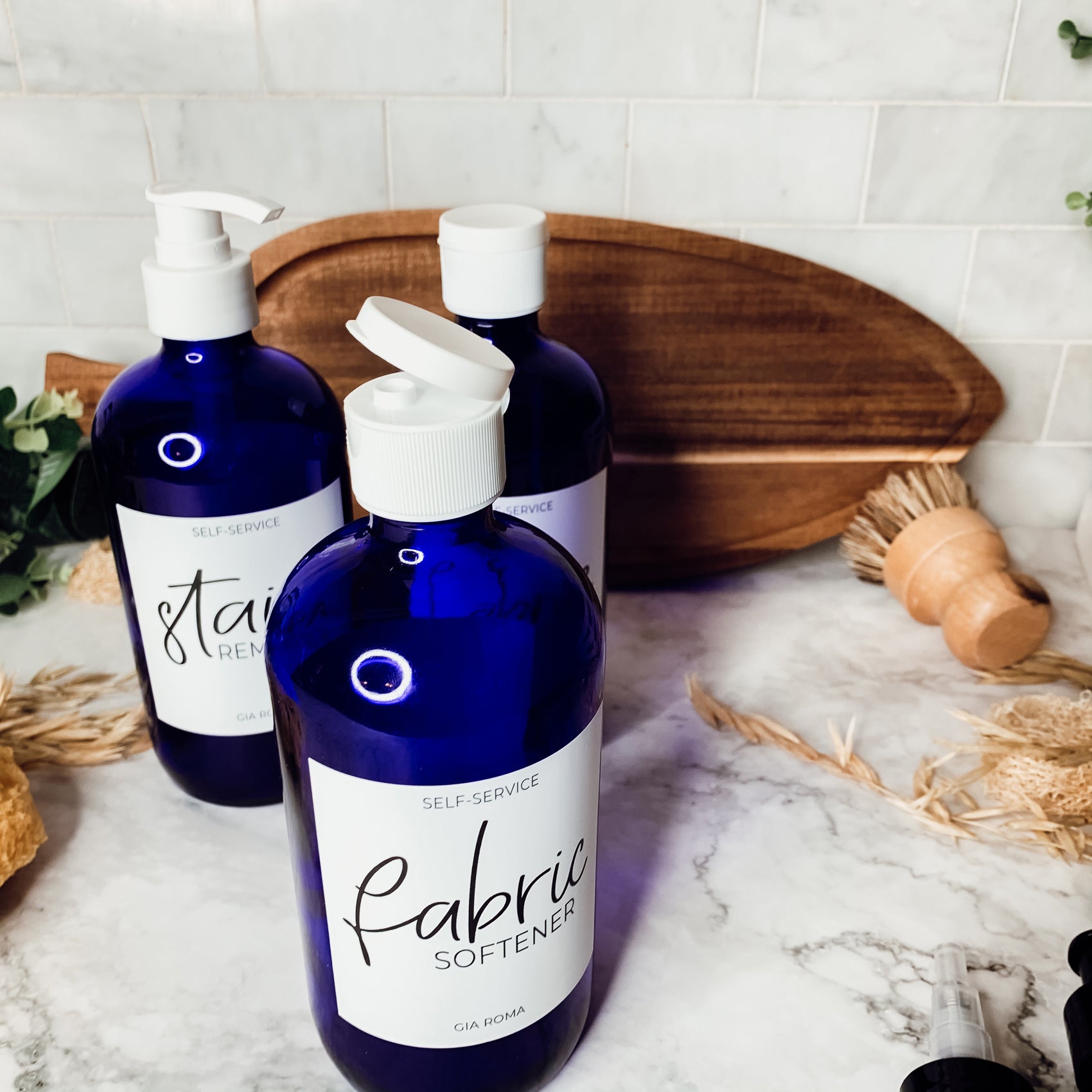 16oz blue glass dispenser with customizable waterproof labels, perfect for home decor.