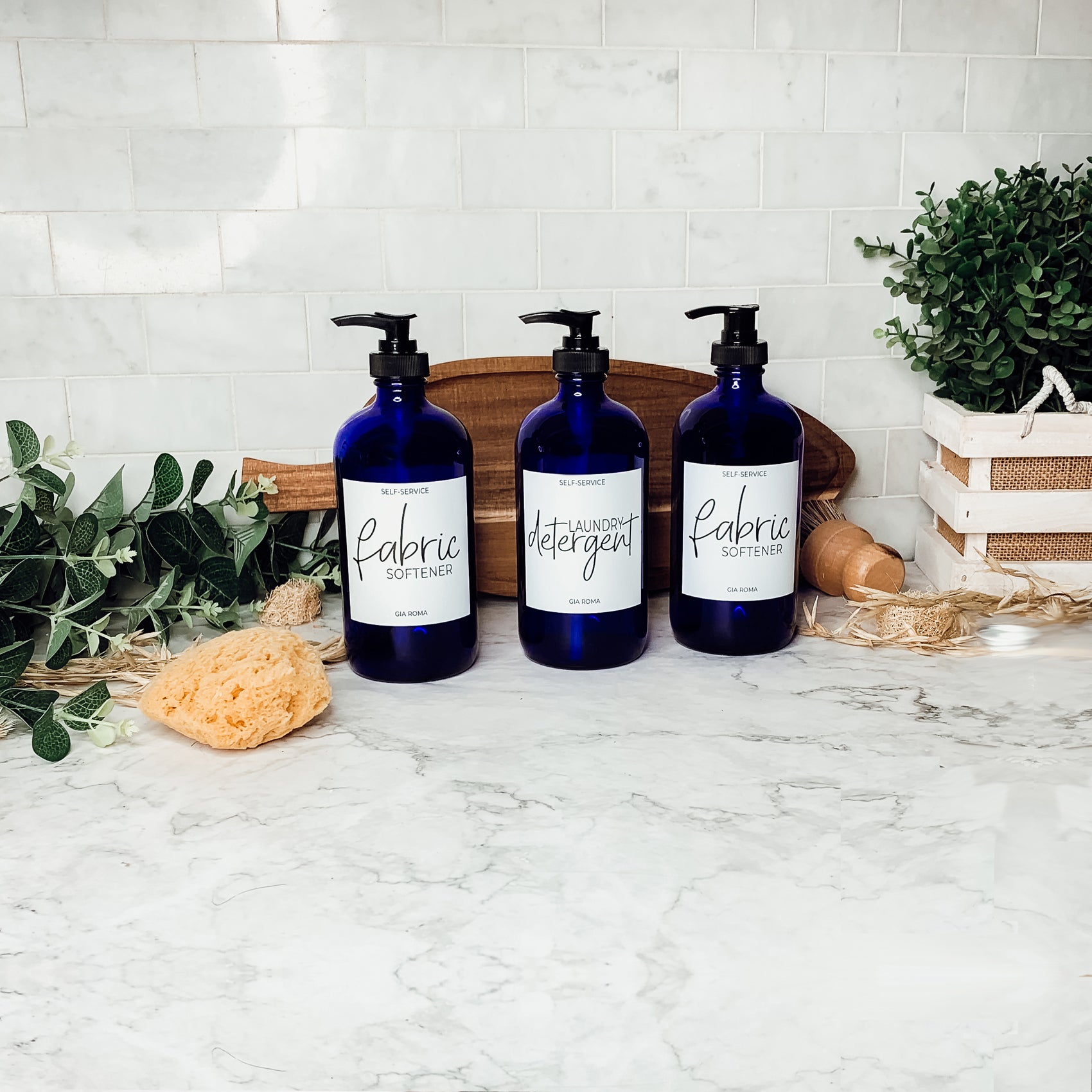 16oz blue glass dispenser with customizable waterproof labels, perfect for home decor.