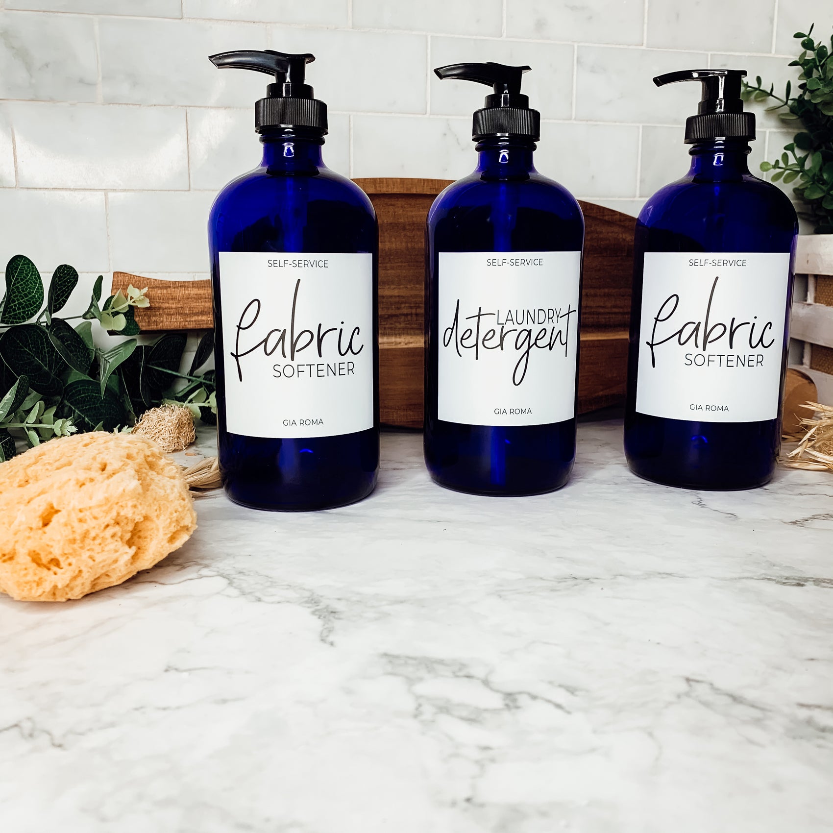 16oz blue glass dispenser with customizable waterproof labels, perfect for home decor.