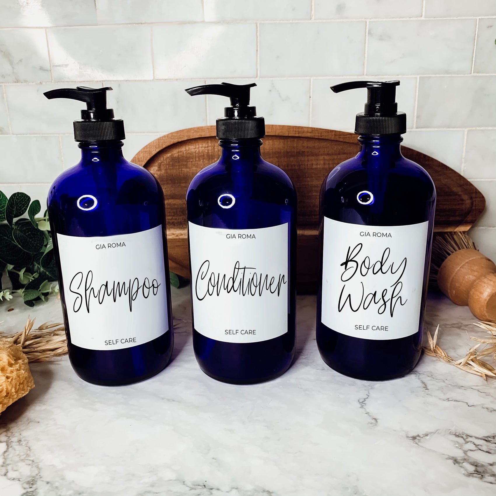 16oz blue glass dispenser with customizable waterproof labels, perfect for home decor.