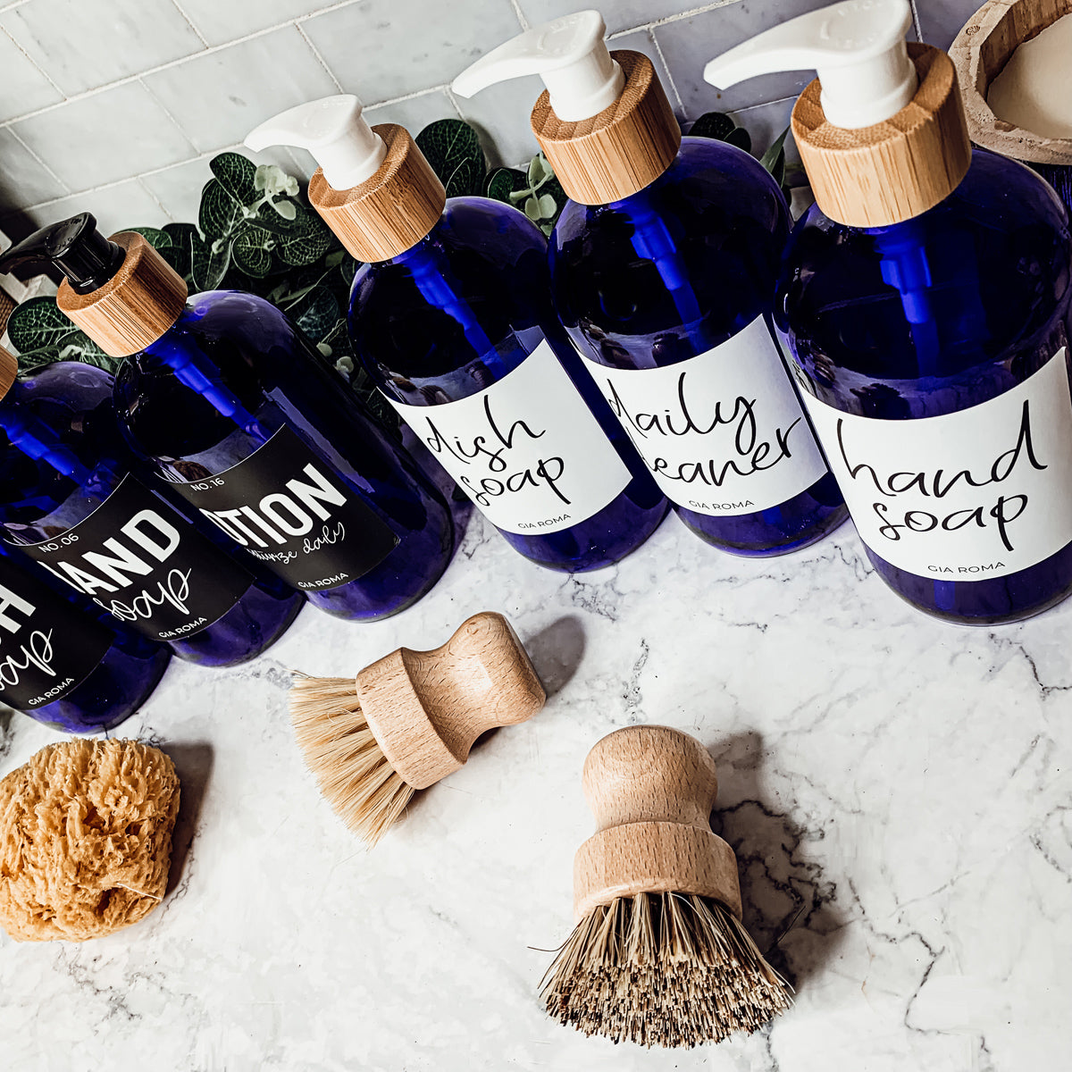 16oz blue glass dispenser with customizable waterproof labels, perfect for home decor.