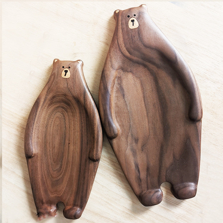 Cute bear-shaped wooden bread plate made from bamboo, featuring a creative design with inlaid details.