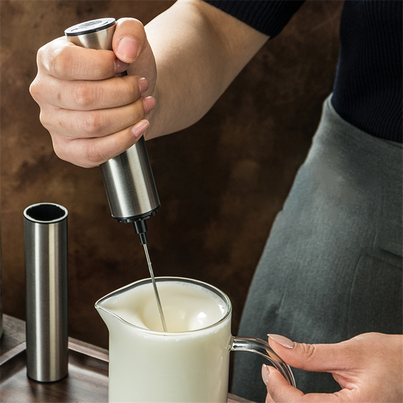 Handheld Electric Coffee Blender Milk Frother with stainless steel whisk and ABS plastic body, designed for frothing milk and mixing beverages.
