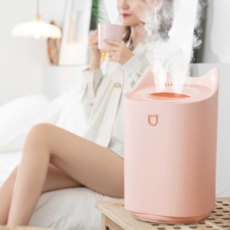 A pink humidifier in use.