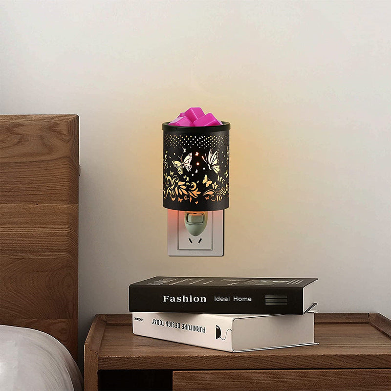 Metal Wall-Plug Wax Melt Warmer featuring elegant metal patterns, designed for aromatherapy and as a night light.