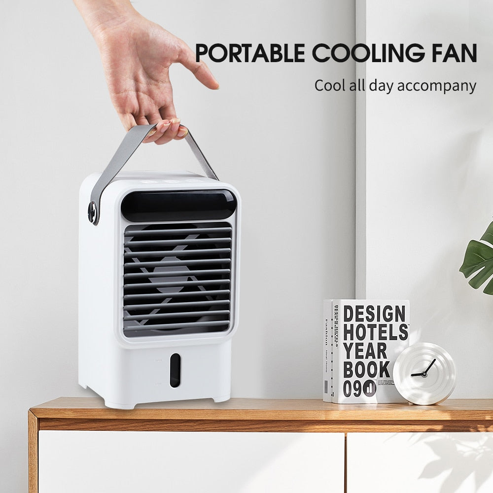 Mini Portable Air Conditioner Fan with water tank and soft lighting, designed for rapid cooling in any room.