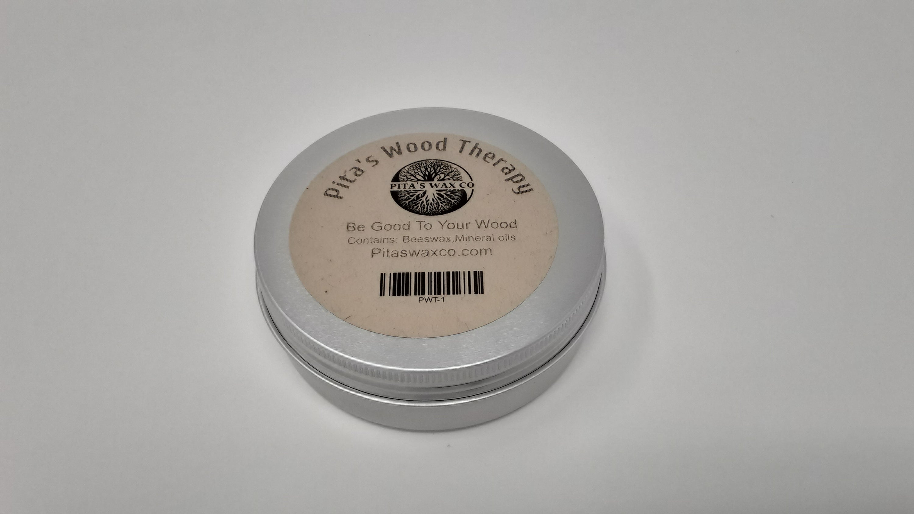 Pita's Wood Therapy Best Wood Wax jar with a wooden spoon and cutting board in the background, showcasing its natural ingredients.