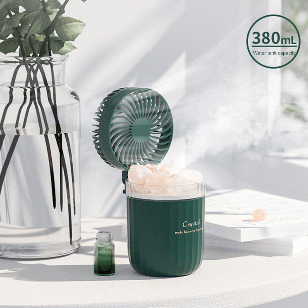 Portable Crystal Aromatherapy Humidifier in white, pink, and green colors with USB charging, featuring a crystal structure and a fan.