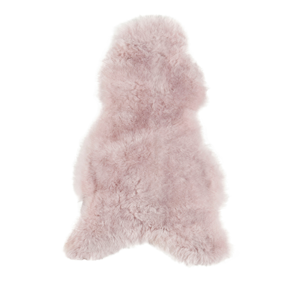 Lichtroze IJslandse schapenvacht van 100 x 65 cm, zacht en wollig, perfect voor interieurdecoratie.