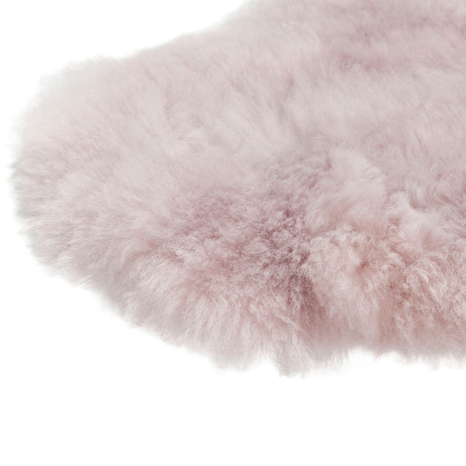 Lichtroze IJslandse schapenvacht van 100 x 65 cm, zacht en wollig, perfect voor interieurdecoratie.
