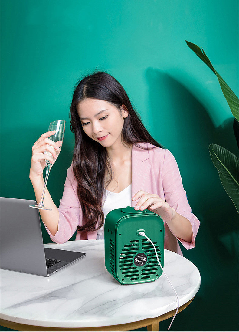 Small Portable USB Cooling Fan with water tank and adjustable wind direction, ideal for home and office use.