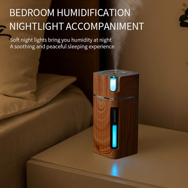 Ultrasonic Air Humidifier USB Mini Mist Maker with LED light in light wood grain finish, showcasing its compact design and mist output.