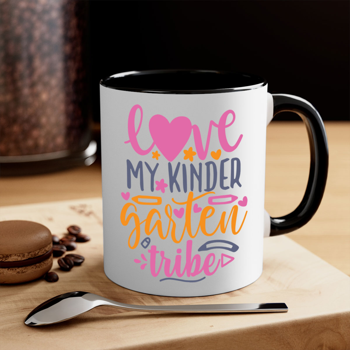 Ceramic '100 Love My Kindergarten Tribe' mug with colorful handle and interior, available in two sizes.