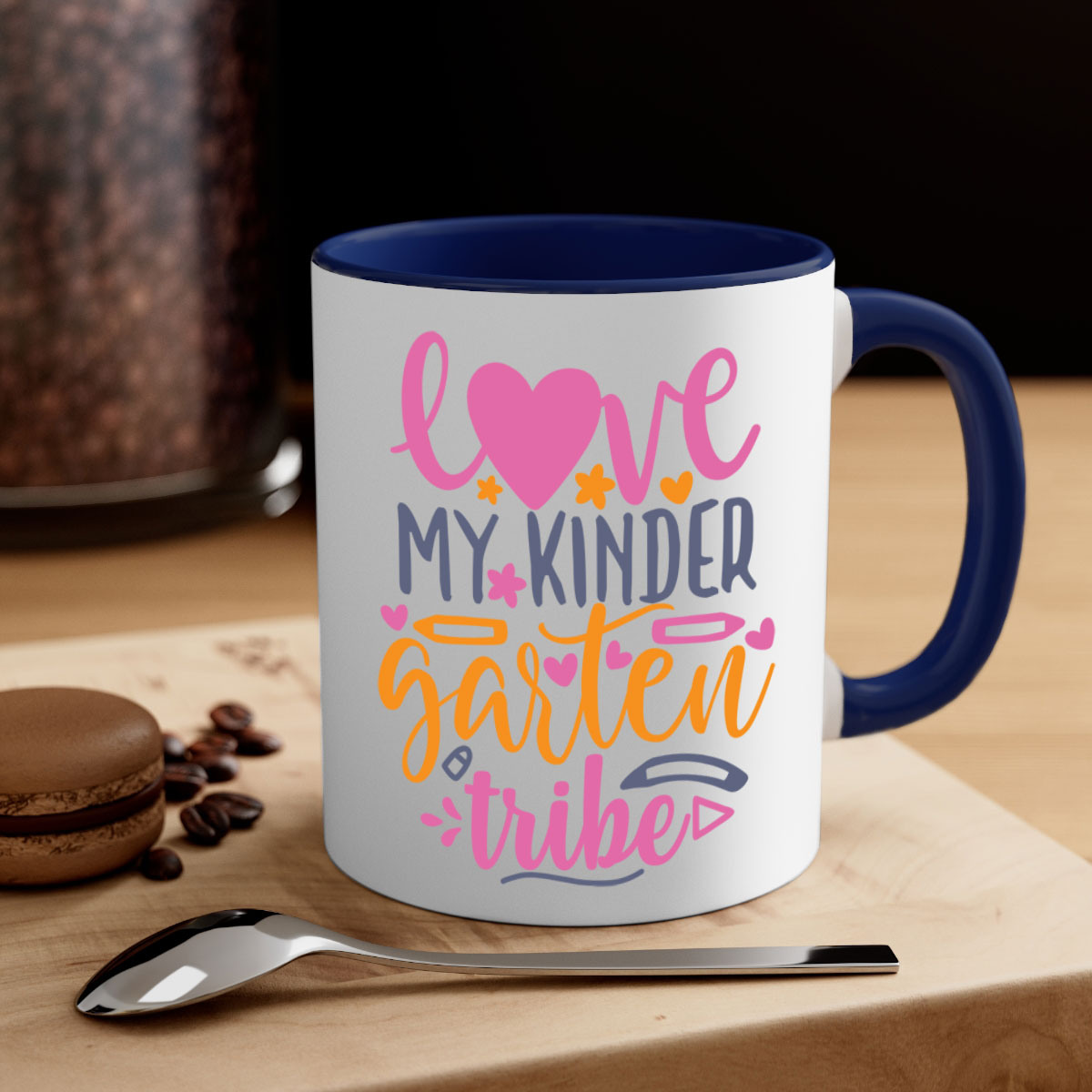 Ceramic '100 Love My Kindergarten Tribe' mug with colorful handle and interior, available in two sizes.