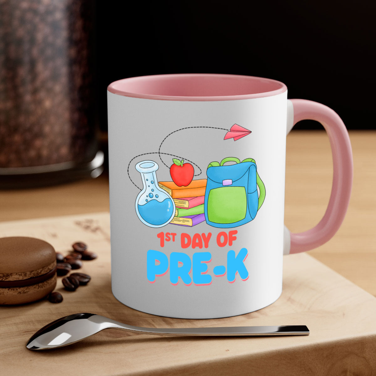 A two-tone ceramic coffee mug celebrating the 1st day of PreK, featuring a colored handle and glossy finish.