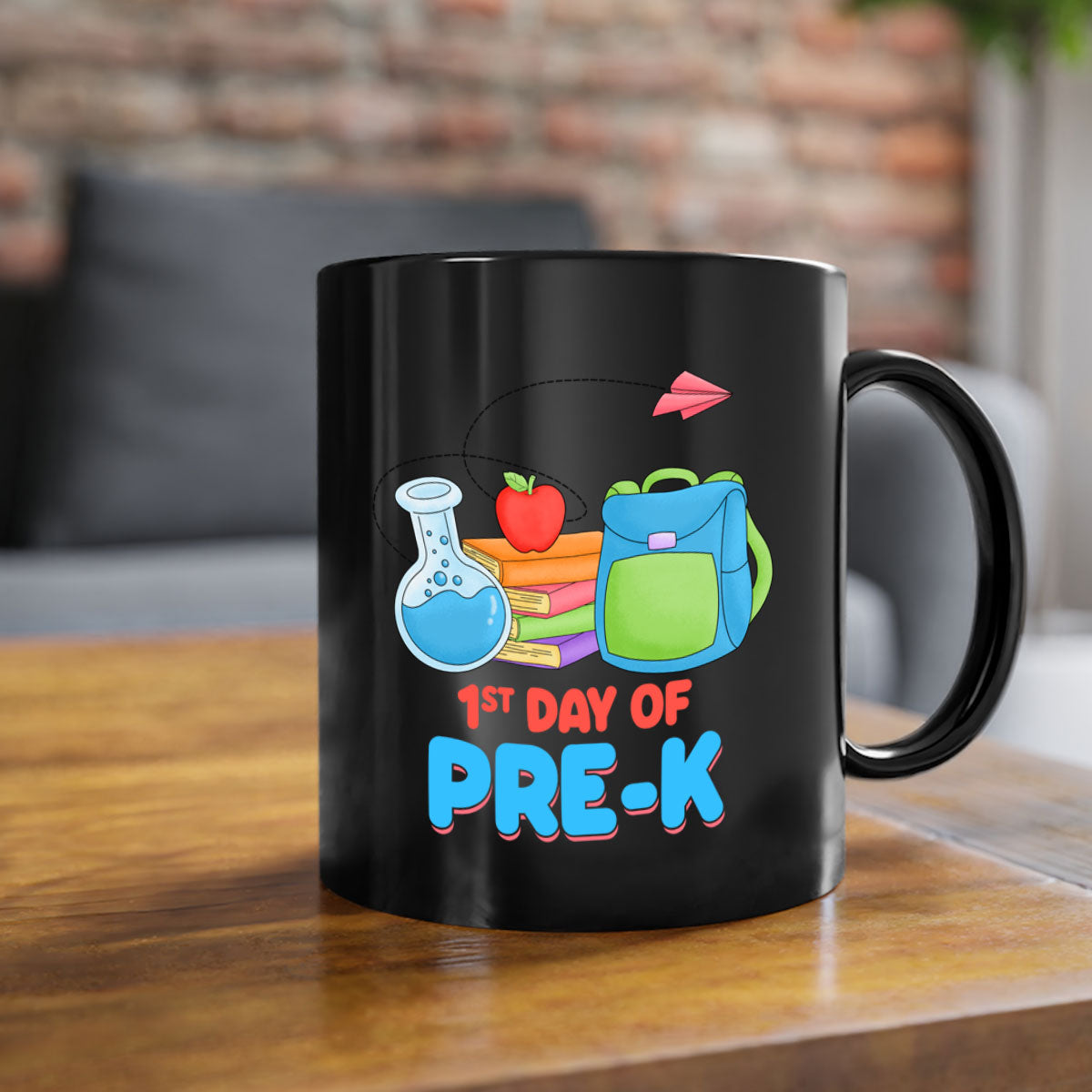 A two-tone ceramic coffee mug celebrating the 1st day of PreK, featuring a colored handle and glossy finish.