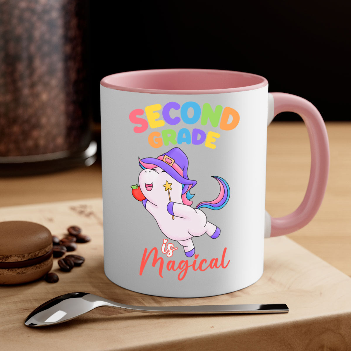 A colorful 2nd Grade is Magical Unicorn Mug with a glossy finish, featuring a unicorn design and a C-shaped handle, available in multiple colors.