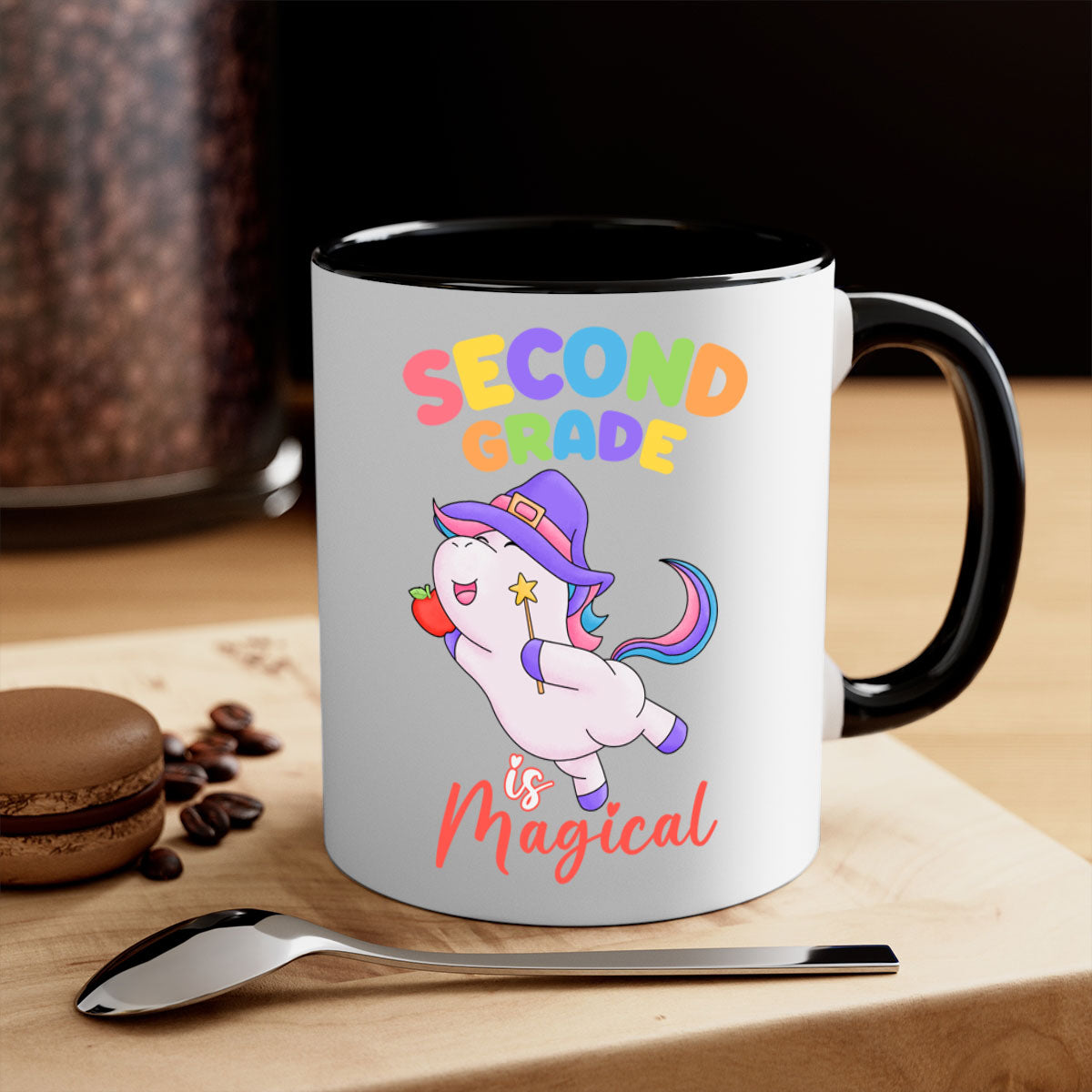 A colorful 2nd Grade is Magical Unicorn Mug with a glossy finish, featuring a unicorn design and a C-shaped handle, available in multiple colors.