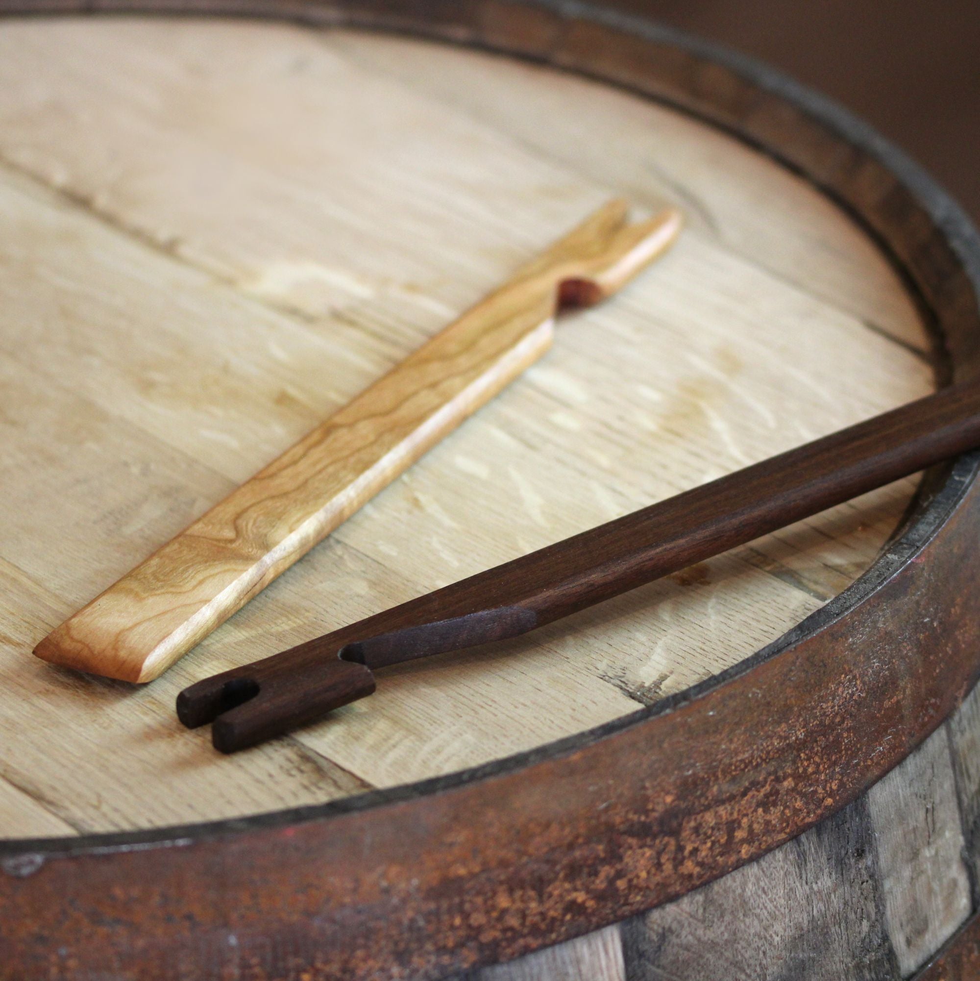 3-in-1 oven rack puller, pusher, and scraper made of cherry wood, showcasing its ergonomic design and natural finish.