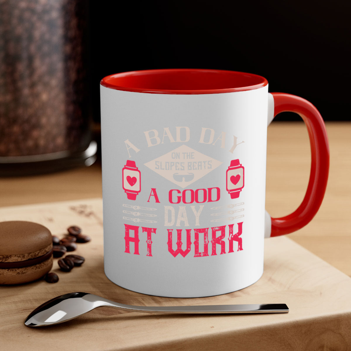 A stylish two-tone ceramic mug with the phrase 'A bad day on the slopes beats a good day at work' printed on it, featuring a colored handle and glossy finish.
