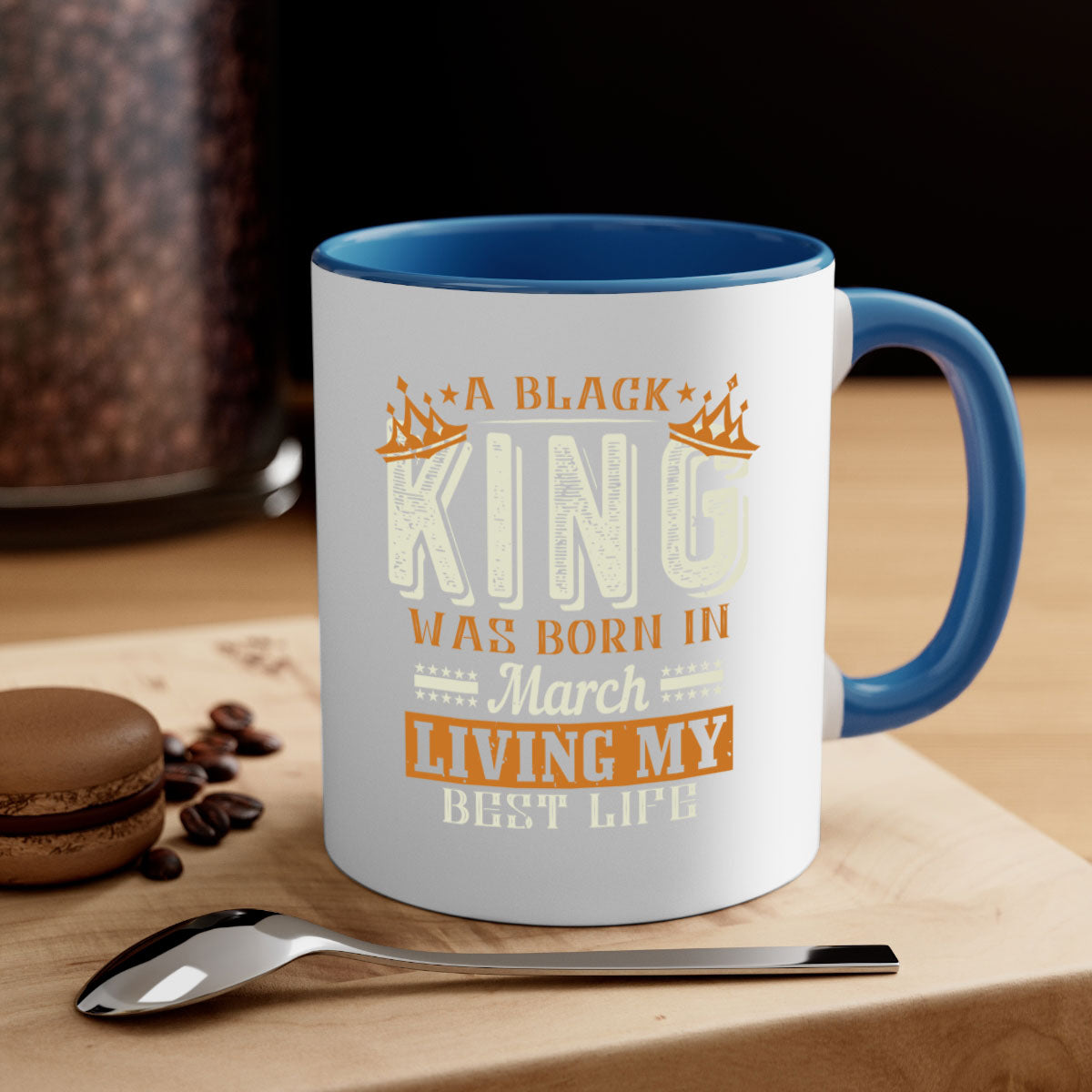 A stylish two-tone ceramic mug with a black handle and interior, featuring the phrase 'A Black King Was Born in March' in elegant font.