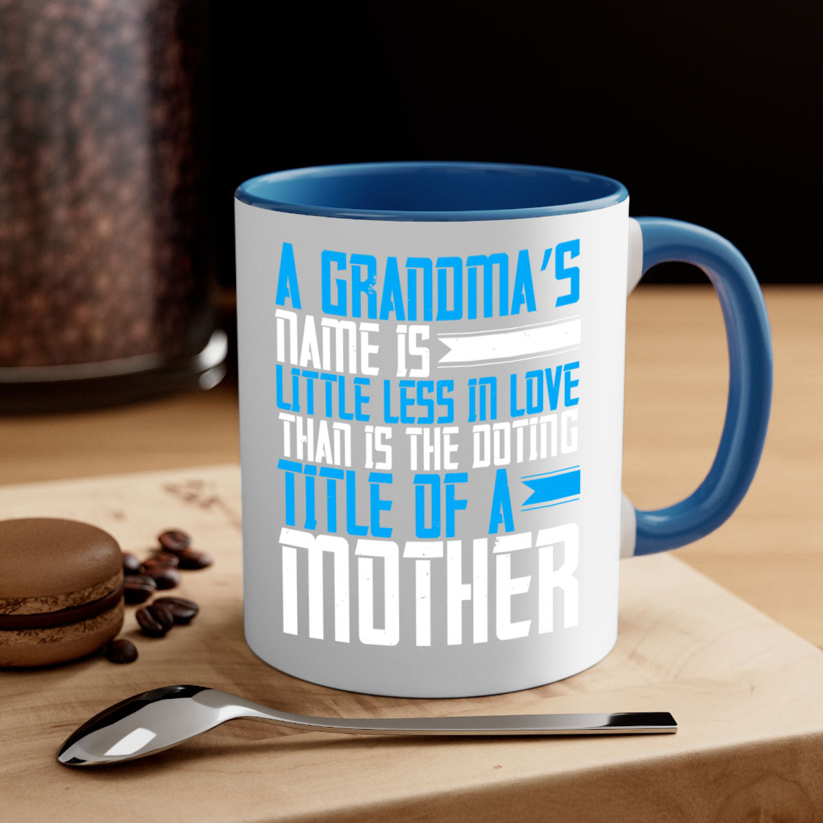 A stylish two-tone ceramic mug with a colored handle and interior, featuring a heartfelt grandma-themed design.