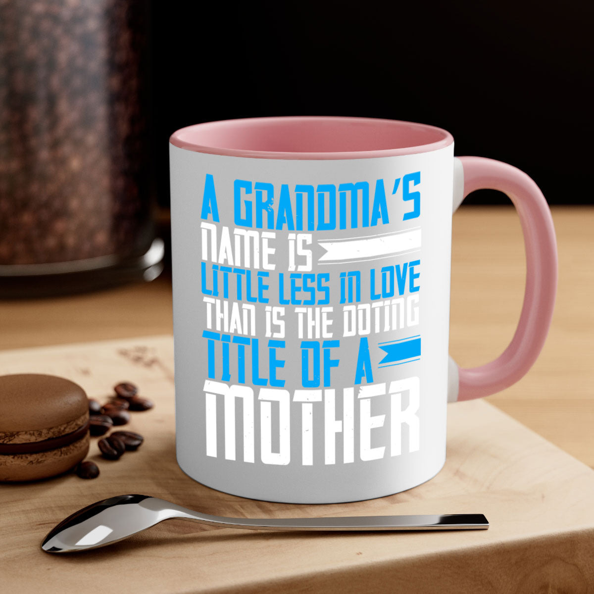 A stylish two-tone ceramic mug with a colored handle and interior, featuring a heartfelt grandma-themed design.
