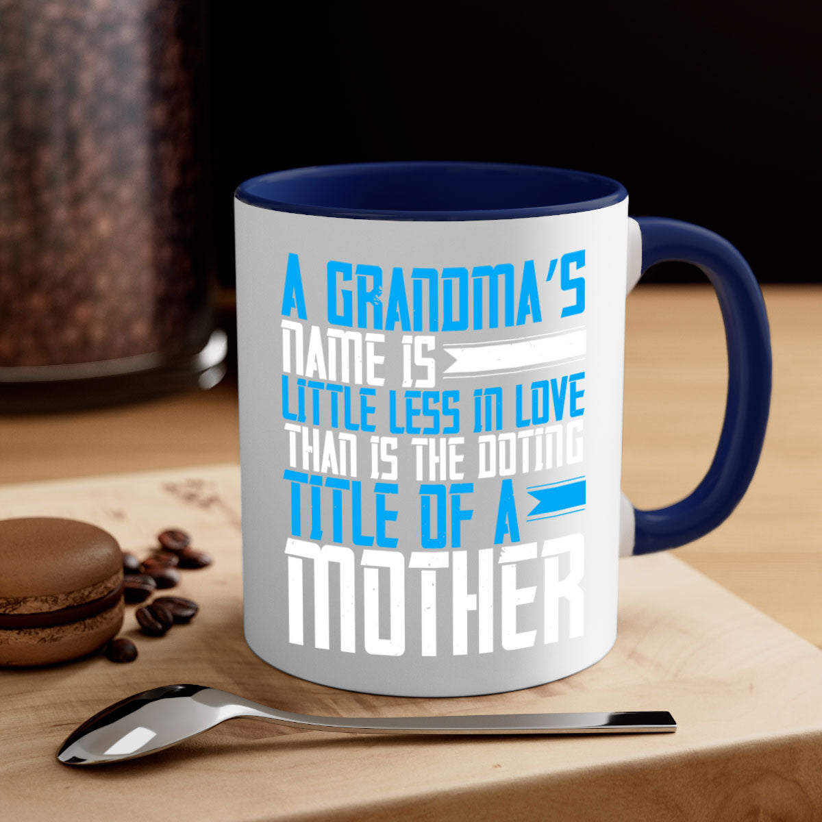 A stylish two-tone ceramic mug with a colored handle and interior, featuring a heartfelt grandma-themed design.