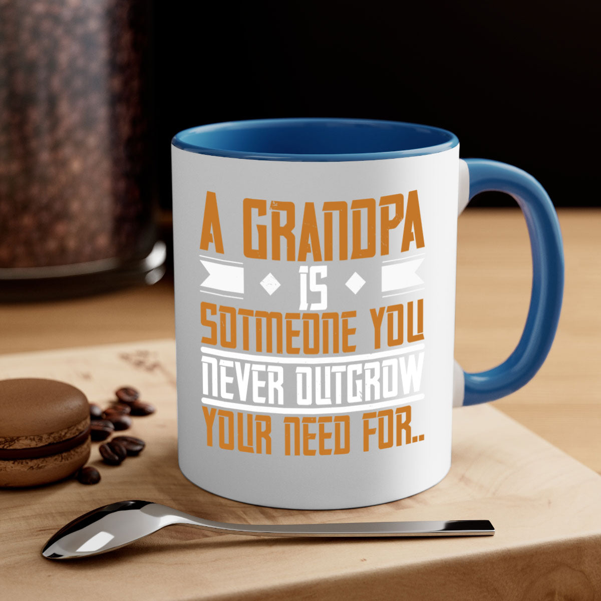A stylish two-tone ceramic mug with a colored handle and glossy finish, featuring the phrase 'A grandpa is someone you never outgrow' in a charming design.