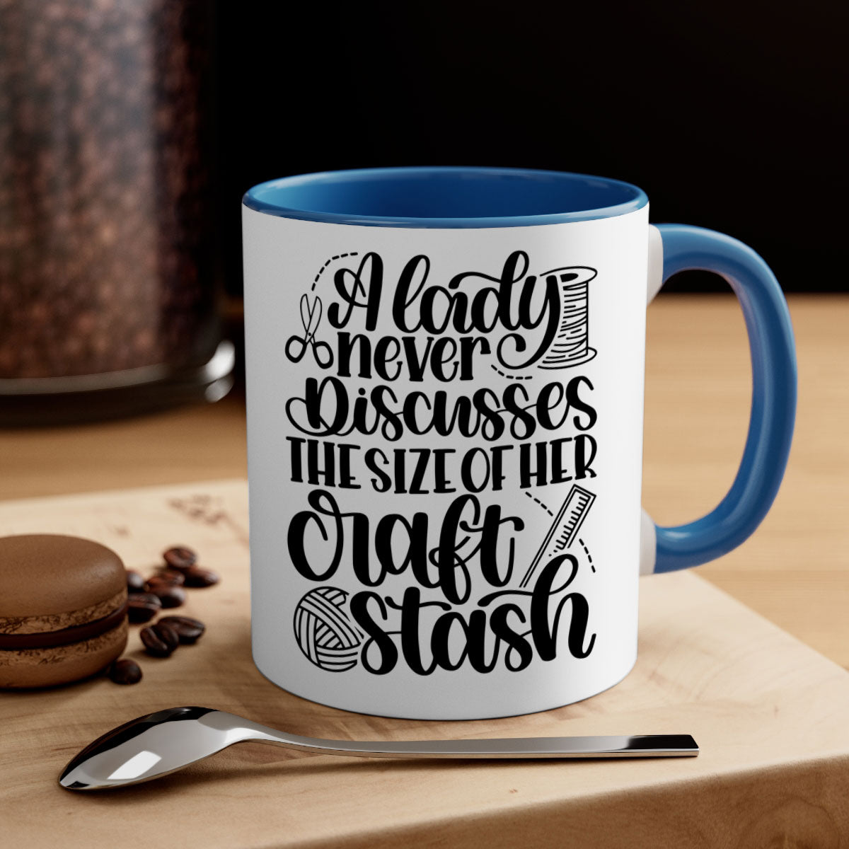A stylish two-tone ceramic mug with the phrase 'A Lady Never Discusses The Size Of Her Craft Stash', featuring a colored handle and glossy finish.