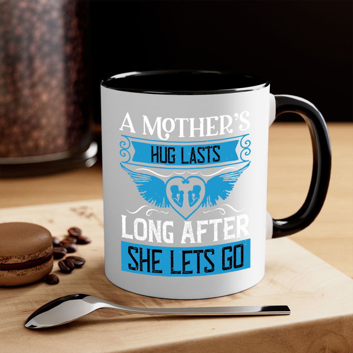 A stylish two-tone coffee mug with a colored handle and glossy finish, perfect for Mother's Day gifts.