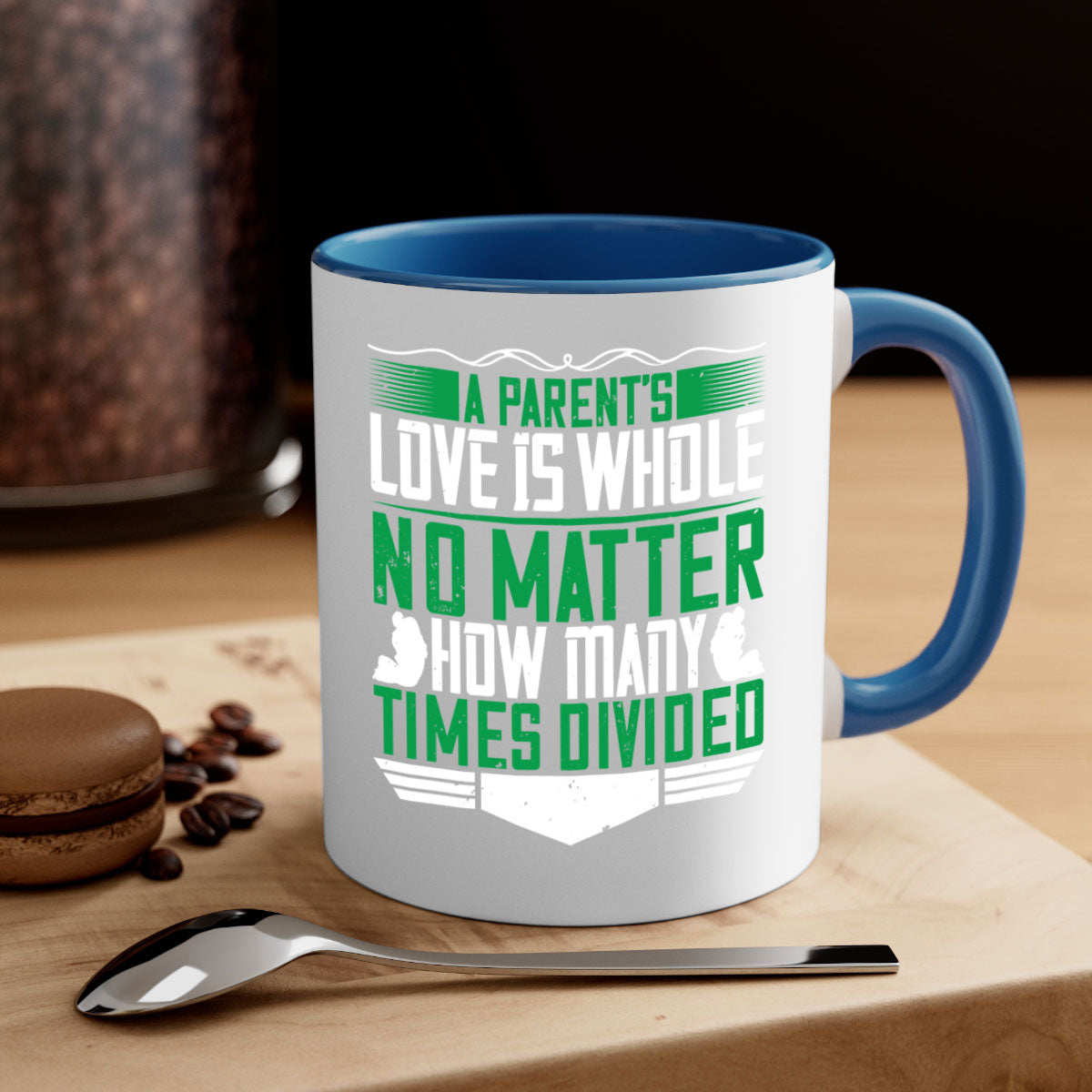 A two-tone ceramic mug with a glossy finish, featuring a colored handle and interior, showcasing the phrase 'A Parent’s Love is Whole No Matter How Many Times Divided'.
