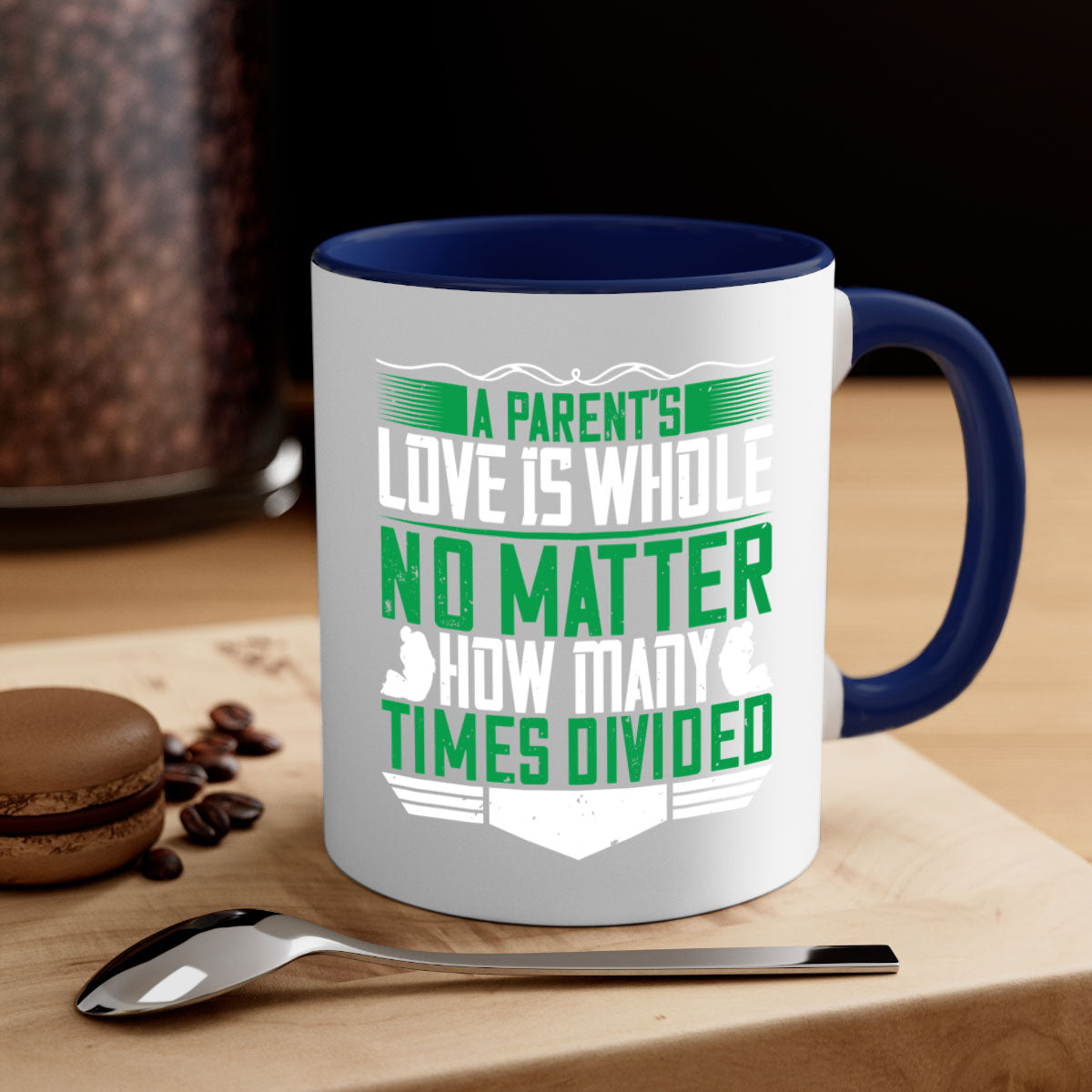 A two-tone ceramic mug with a glossy finish, featuring a colored handle and interior, showcasing the phrase 'A Parent’s Love is Whole No Matter How Many Times Divided'.