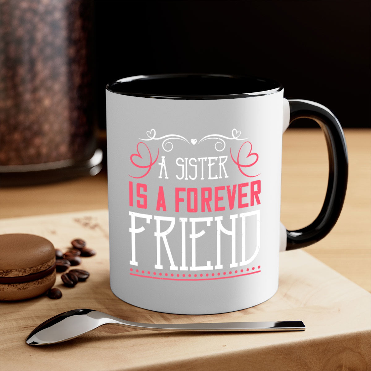 A two-tone ceramic coffee mug with the phrase 'A Sister is a Forever Friend' printed on it, featuring a colored handle and glossy finish.