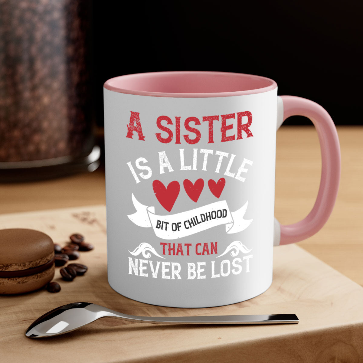 Ceramic mug with a glossy finish featuring a heartfelt message about sisterhood, available in multiple colors.