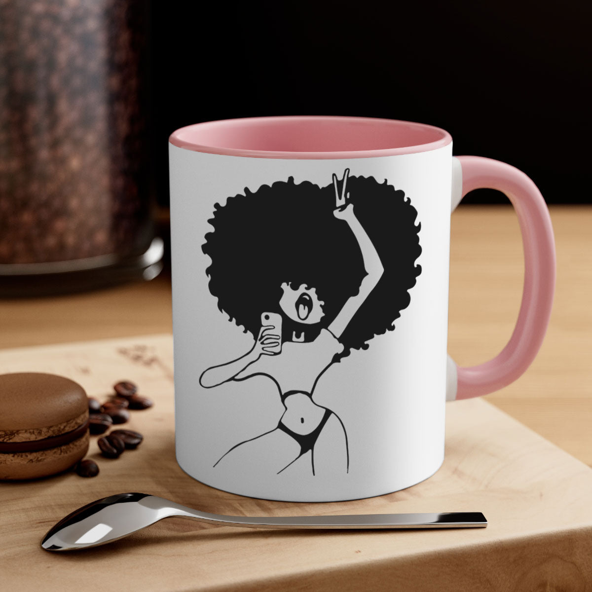 A stylish coffee mug featuring an afro woman taking a selfie, with a glossy finish and a colored handle.