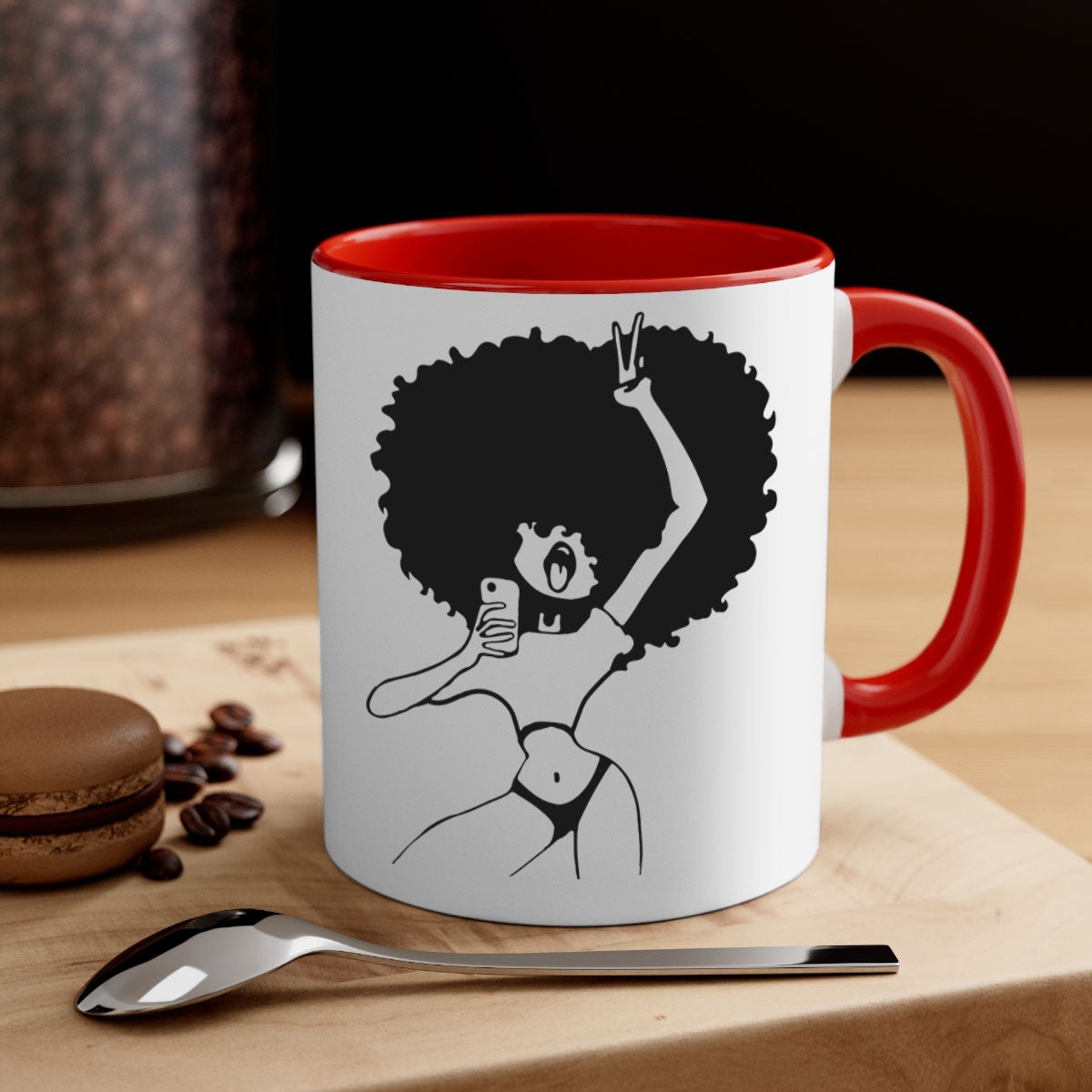 A stylish coffee mug featuring an afro woman taking a selfie, with a glossy finish and a colored handle.