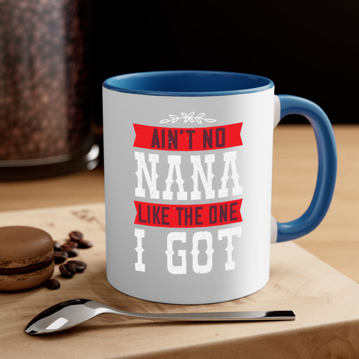 AIN’T NO NANA LIKE THE ONE i GOT mug with a colorful handle and glossy finish, perfect for coffee or tea.