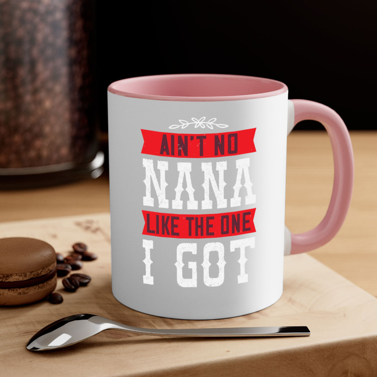 AIN’T NO NANA LIKE THE ONE i GOT mug with a colorful handle and glossy finish, perfect for coffee or tea.