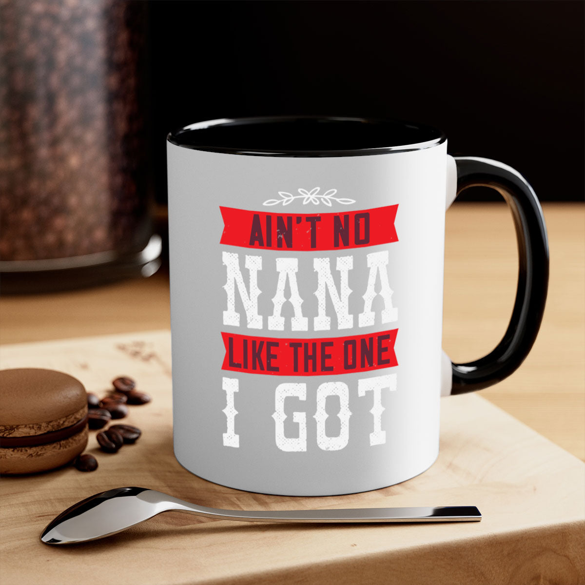 AIN’T NO NANA LIKE THE ONE i GOT mug with a colorful handle and glossy finish, perfect for coffee or tea.