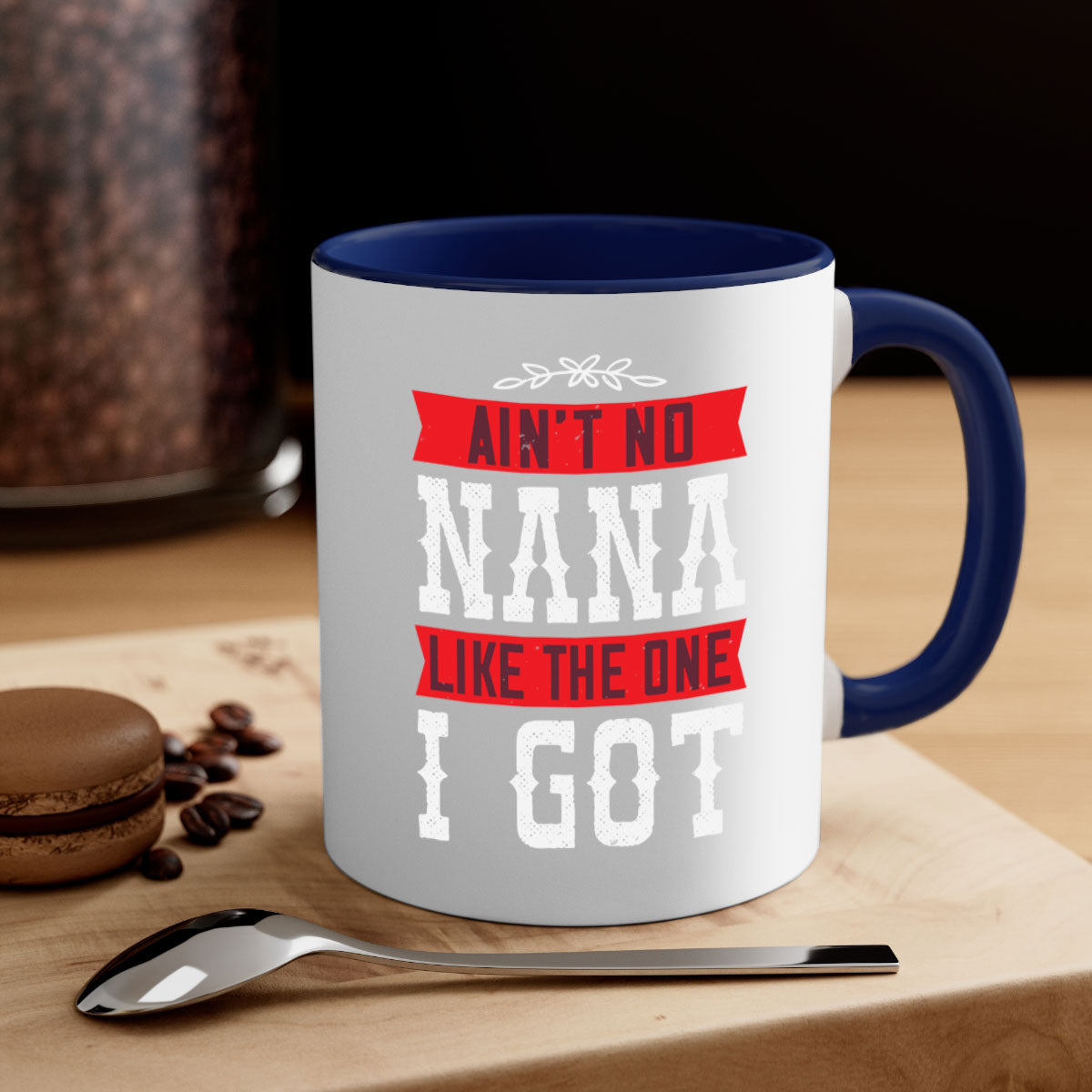 AIN’T NO NANA LIKE THE ONE i GOT mug with a colorful handle and glossy finish, perfect for coffee or tea.