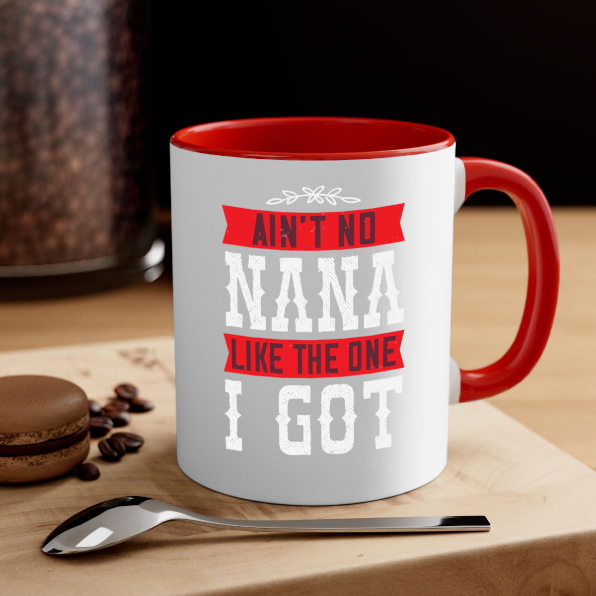 AIN’T NO NANA LIKE THE ONE i GOT mug with a colorful handle and glossy finish, perfect for coffee or tea.