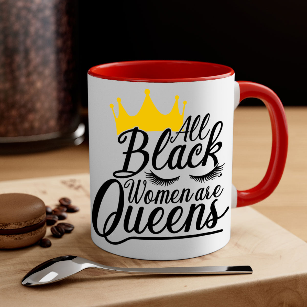 A stylish two-tone ceramic mug featuring the phrase 'All Black Women Are Queens' with a colored handle and glossy finish.