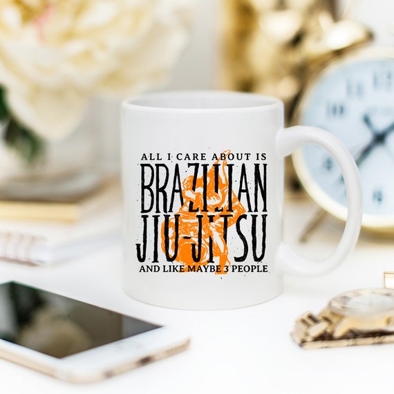 A humorous coffee mug featuring the phrase 'All I Care About Is Brazilian Jiu-Jitsu And Like Maybe 3 People', showcasing a fun design for BJJ enthusiasts.