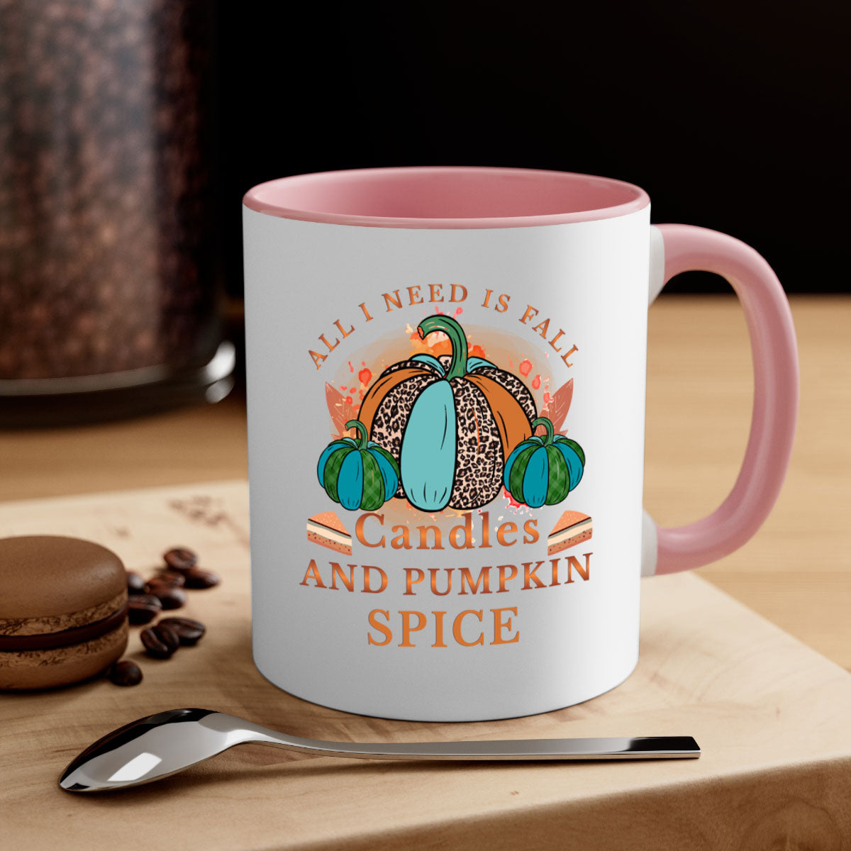 Two-tone ceramic mug with colored handle and glossy finish, featuring the phrase 'All I Need Is Fall Candles And Pumpkin Spice'.