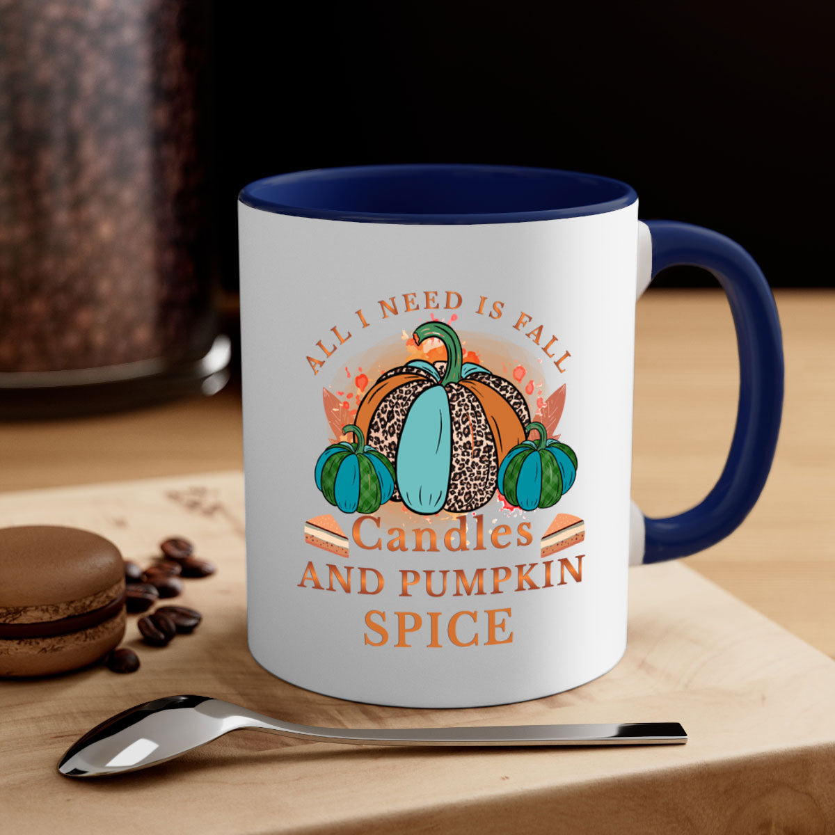Two-tone ceramic mug with colored handle and glossy finish, featuring the phrase 'All I Need Is Fall Candles And Pumpkin Spice'.